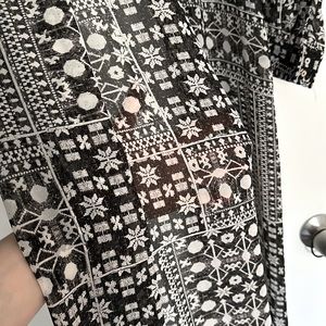 H&M chiffon dress shirt with black and white patterns